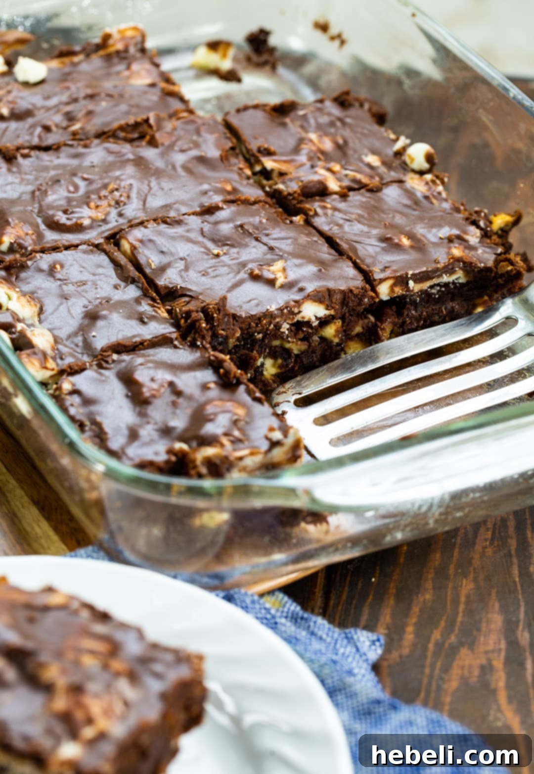Tuxedo Brownies 3 Fudgy Black and White Brownies in a baking dish, freshly baked and still warm, showing the melted white and semi-sweet chocolate chips.