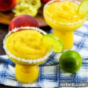 A vibrant Frozen Peach Margarita cocktail