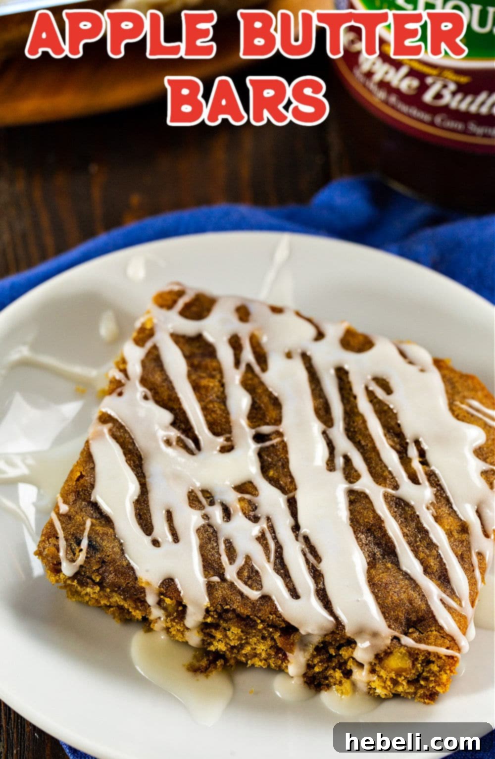 A perfectly baked Apple Butter Bar, glistening with glaze, displayed on a plate, ready to be eaten.