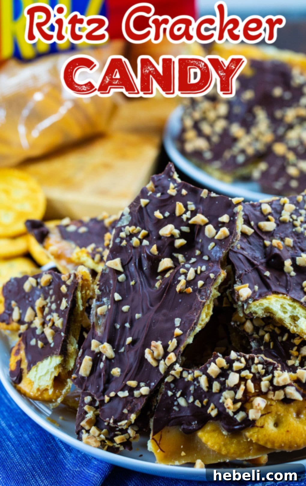 A close-up shot of several broken pieces of delicious Ritz Cracker Toffee, artfully arranged on a clean white plate, highlighting the crispy cracker base, golden toffee, and chocolate with toffee bits.