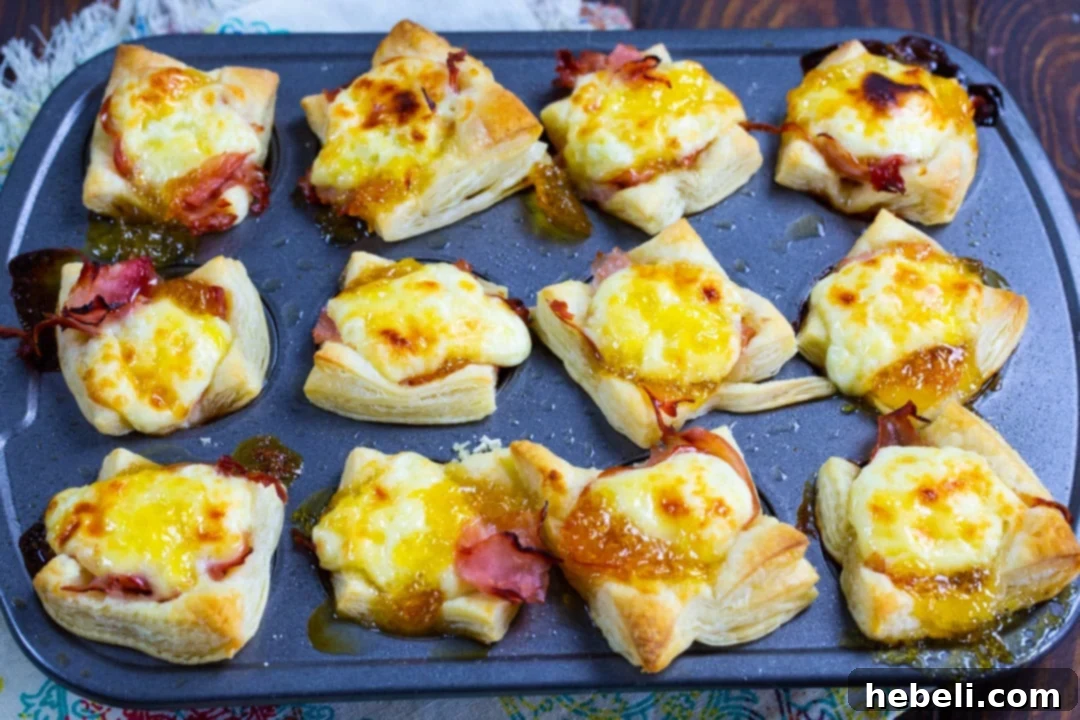 Golden Ham and Brie Pastry Bites 5 Ham and Brie Puff Pastry Cups after being removed from oven.