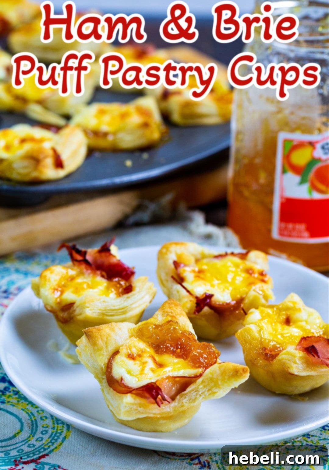 Golden Ham and Brie Pastry Bites 6 Ham and Brie Puff Pastry Cups on a plate.