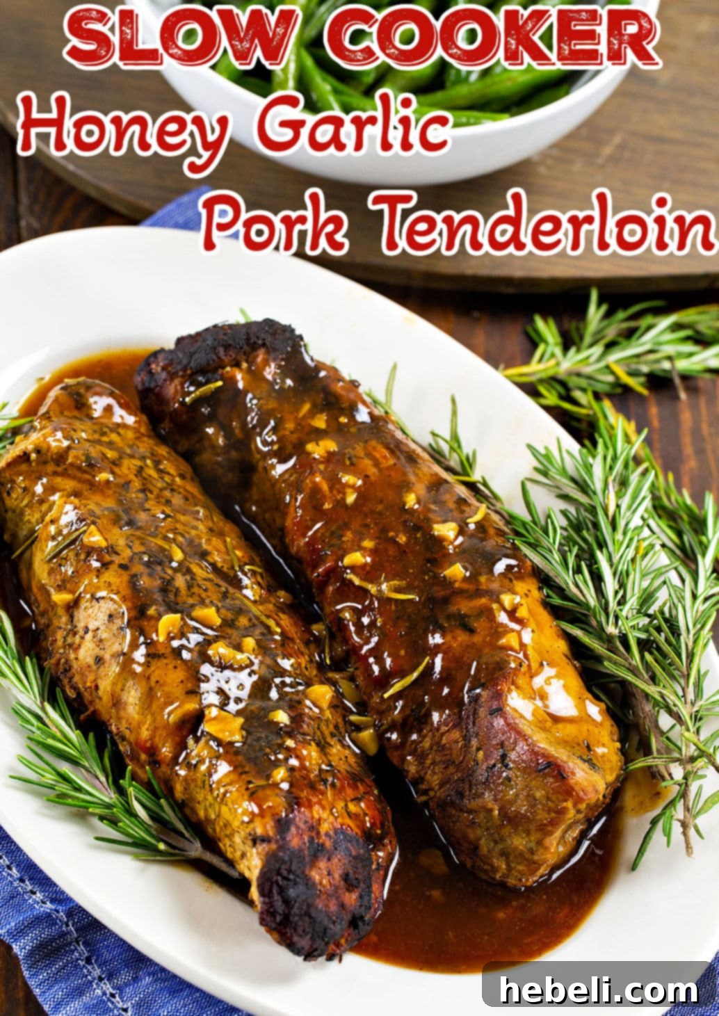 Slow Cooker Honey Garlic Pork Tenderloin on a serving platter, glistening with sauce.