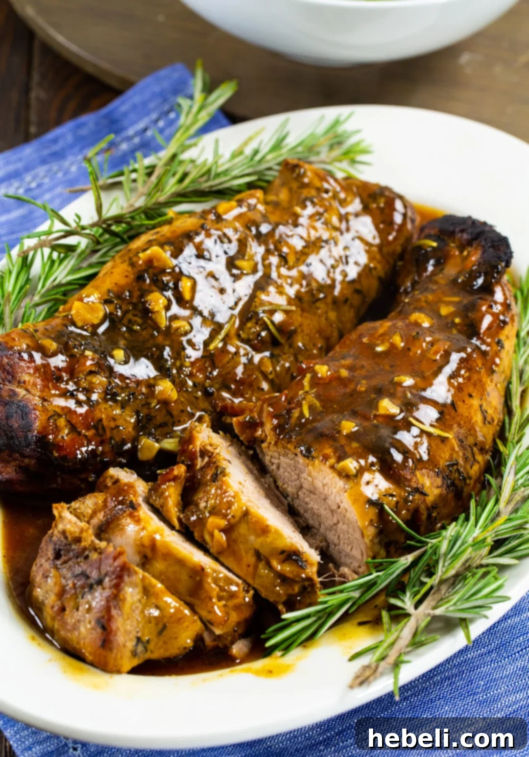 Honey Garlic Pork Tenderloin cut into succulent slices, showcasing its tenderness.