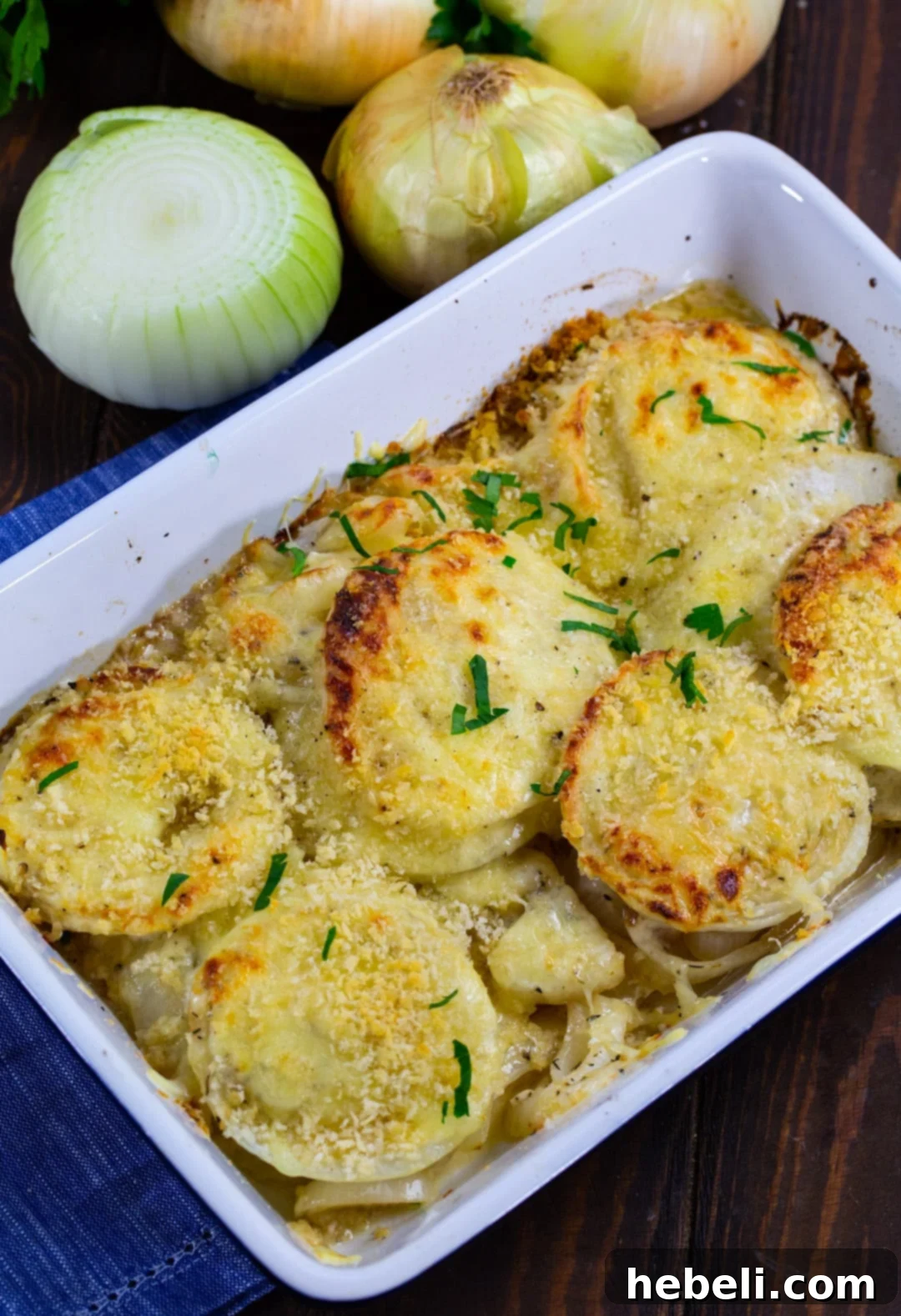 Sweet & Creamy Vidalia Gratin 3 Sliced and partially cooked Vidalia onions in a baking dish, ready for the cheese and cream sauce.