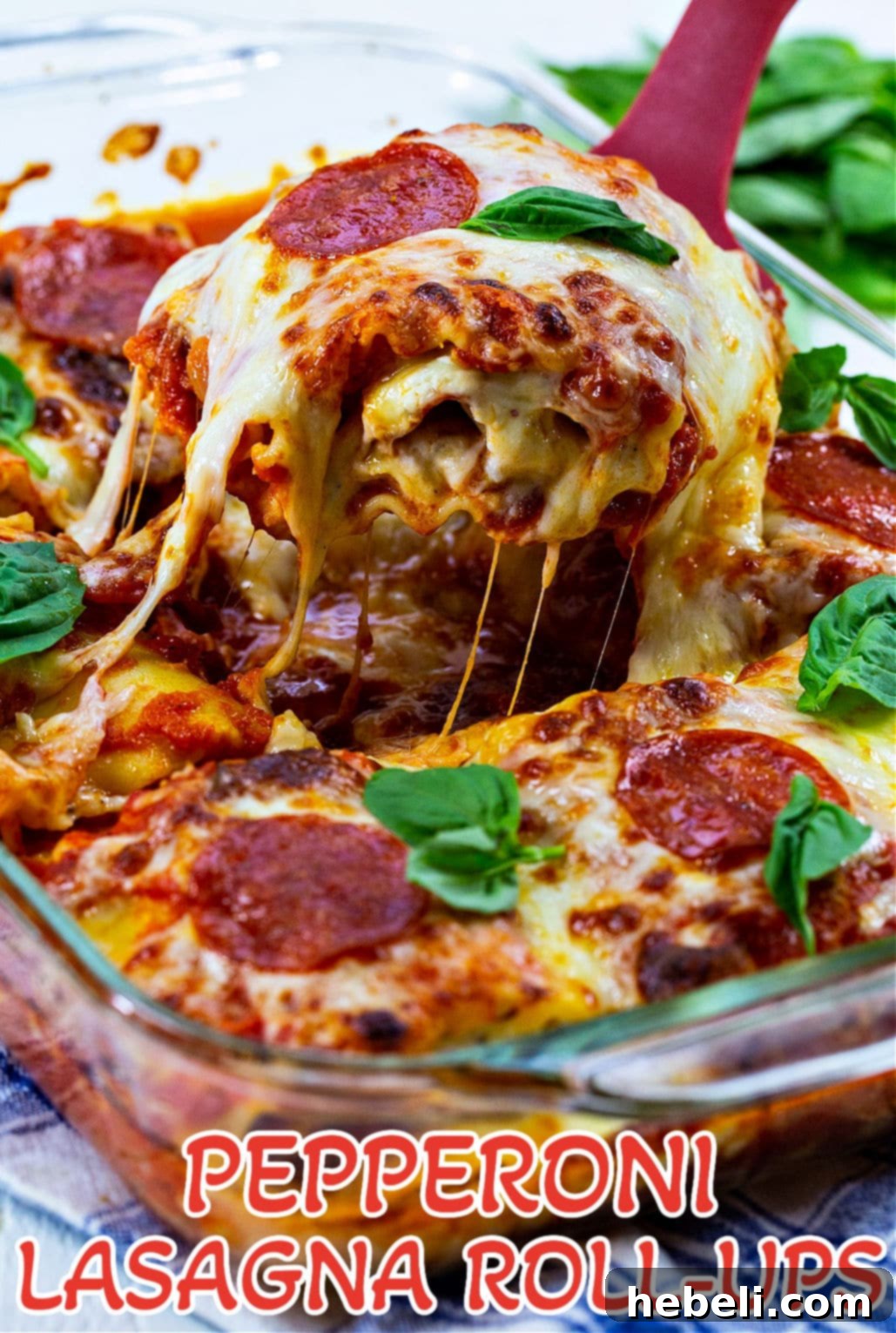 Pepperoni Lasagna Roll-Ups in baking dish.