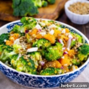 Zesty Orange Feta Broccoli Salad 6 Broccoli Orange Feta Salad in a serving bowl, showcasing its vibrant ingredients.