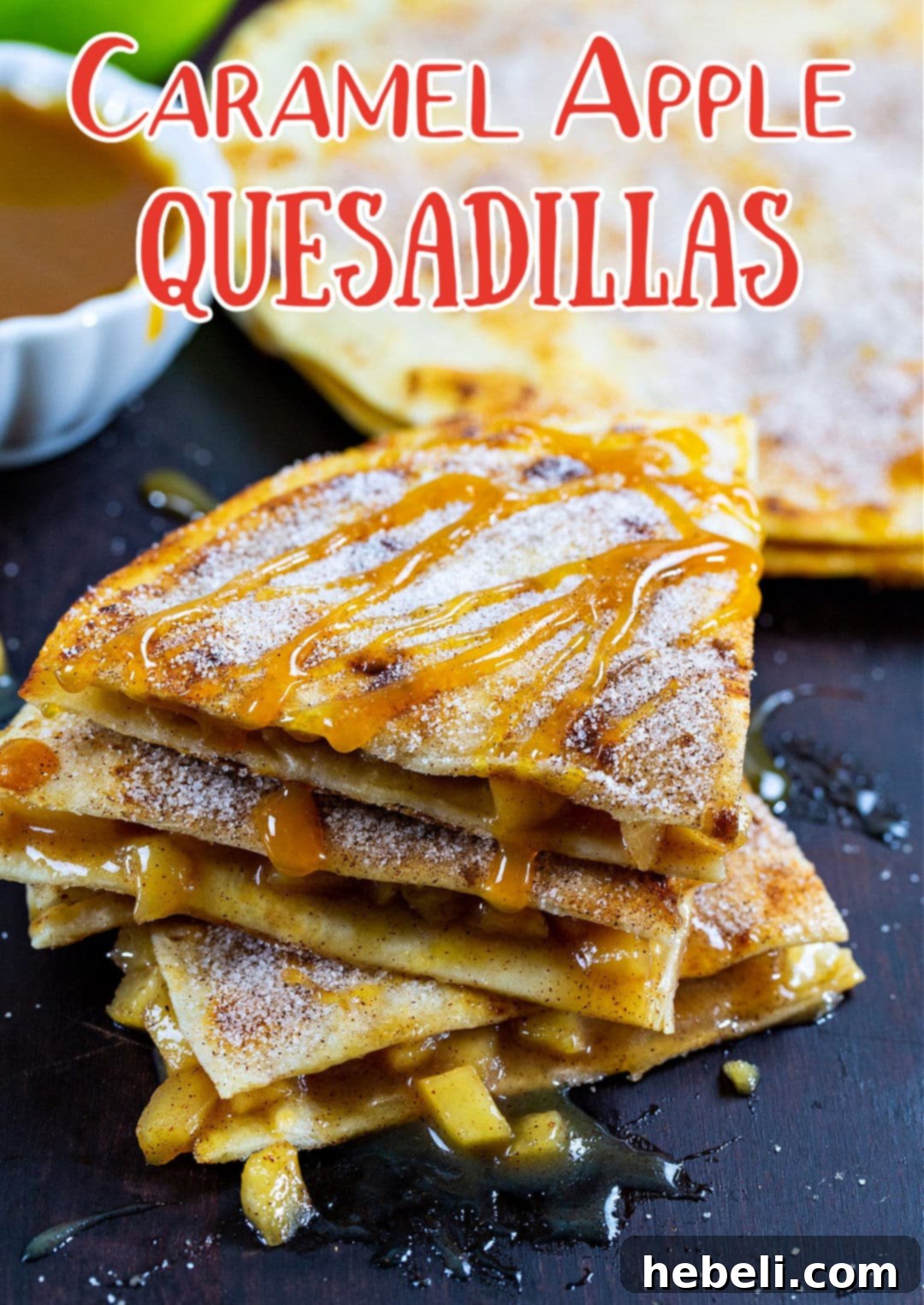 Close-up of Caramel Apple Quesadilla triangles drizzled with generous amounts of caramel sauce.