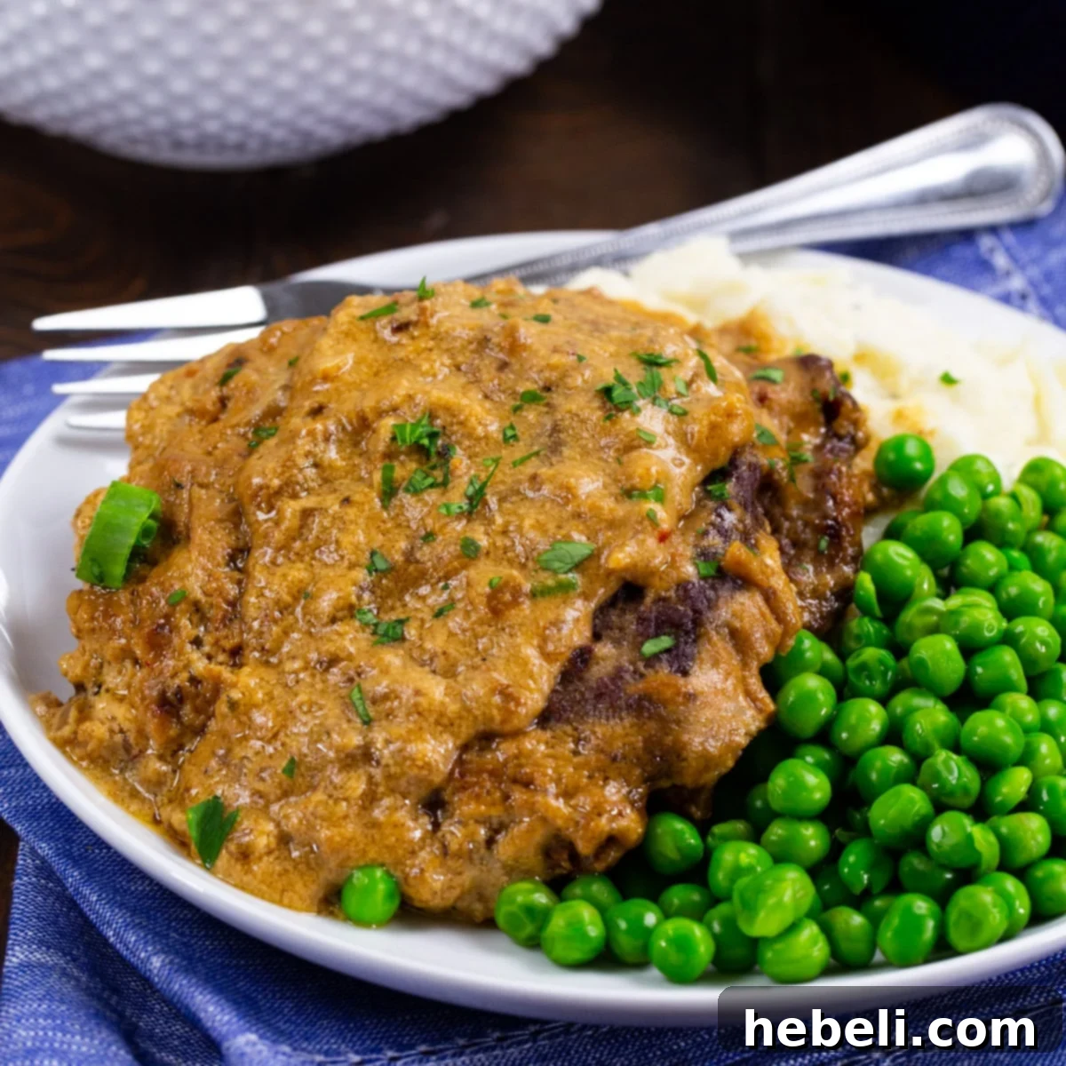 Beef Stroganoff 2 Sour Cream Cubed Beef on plate with mashed potatoes and peas.
