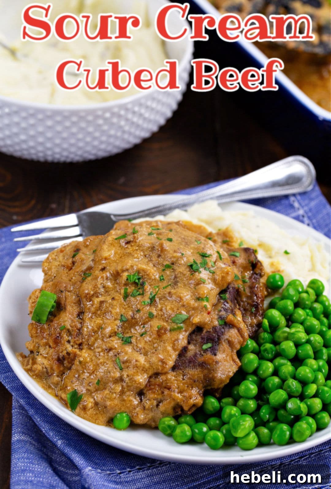 Beef Stroganoff 4 Sour Cream Cubed Beef on plate with peas and mashed potatoes.