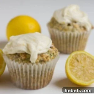lemon poppy seed muffins with cream cheese frosting, freshly baked and ready to enjoy