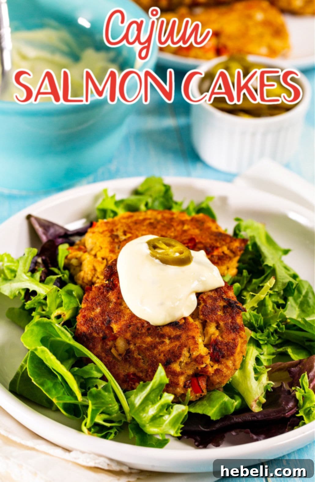 Zesty Bayou Salmon Fritters 5 A close-up shot of a single Cajun Salmon Cake on a clean white plate, ready to be served and enjoyed.