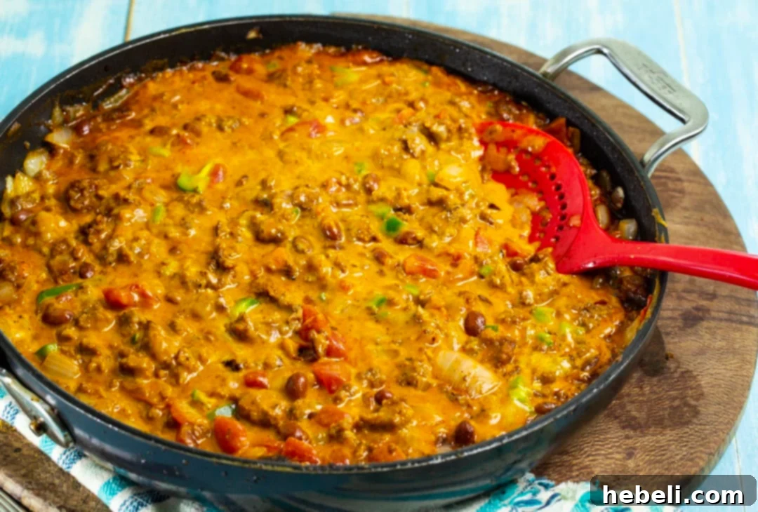 Legendary Chili Cheese Dip 3 Cheese Dip in a skillet.
