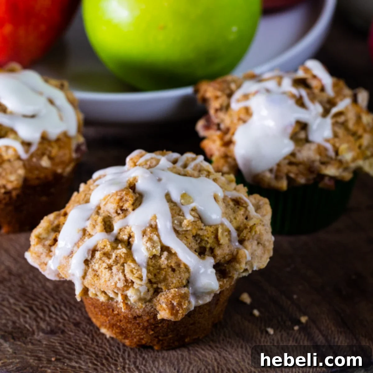 Delicious Apple Spice Muffins drizzled with a sweet glaze, ready to be enjoyed.