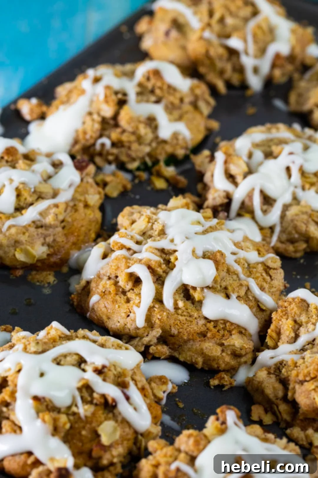 Glazed Apple Spice Muffins in a baking tin, ready to be served or stored.