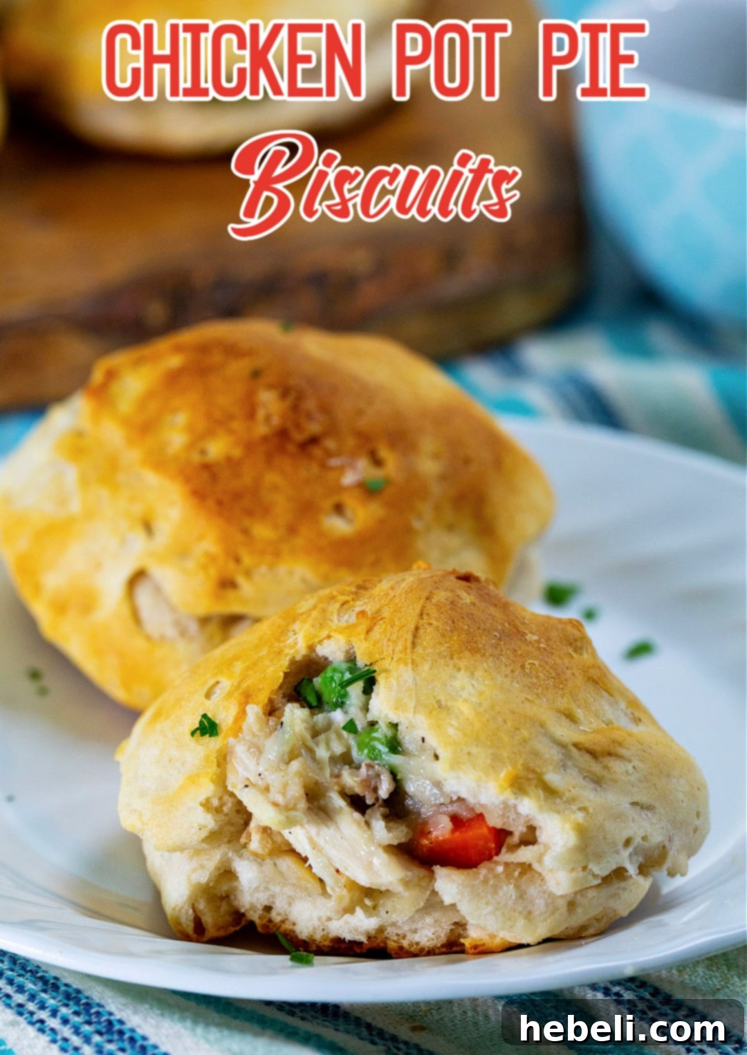 Hearty Chicken and Biscuit Pot Pie 6 Close-up of a Chicken Pot Pie Biscuit with a portion bitten off, showing the rich filling.