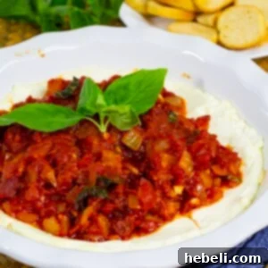 Baked Goat Cheese Dip with fresh basil garnish