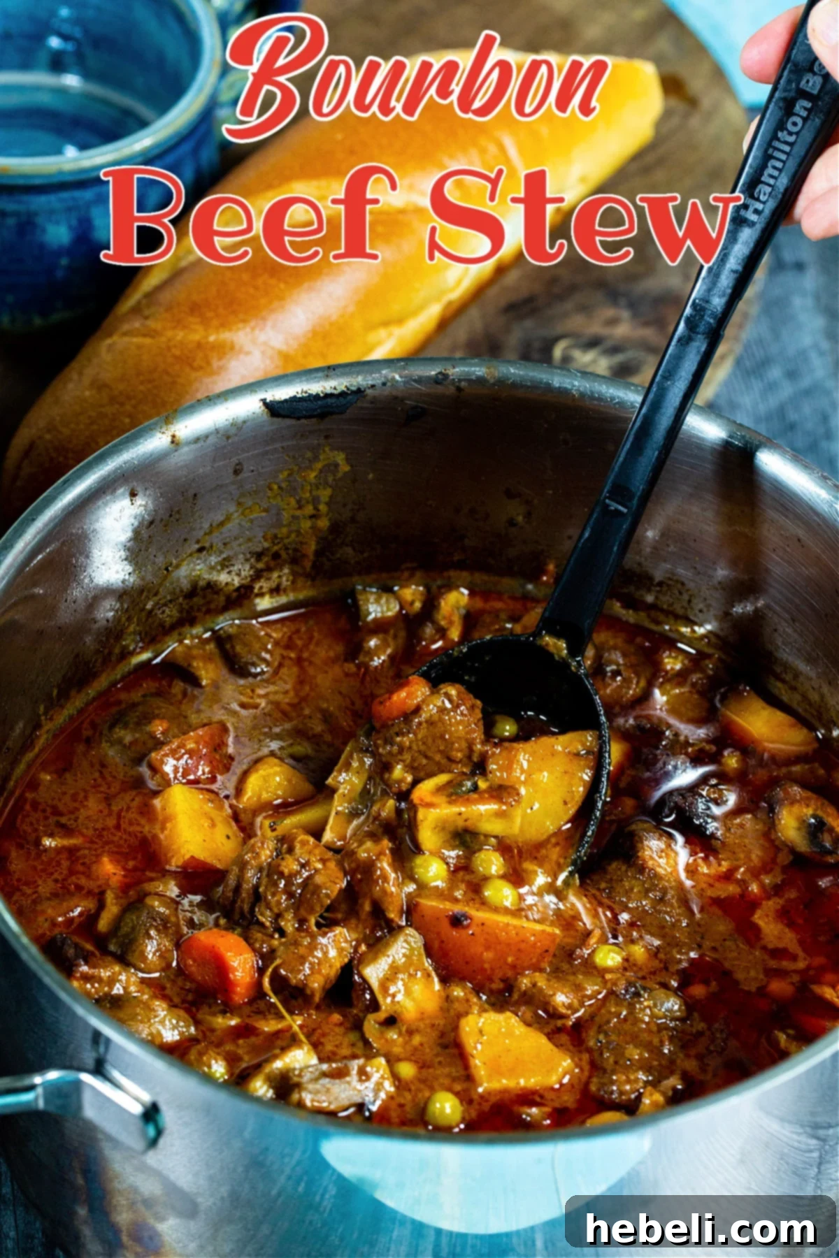Whiskey-Kissed Beef Stew 4 A serving spoon lifting a portion of Bourbon Beef Stew, showing off the rich consistency and chunks of beef and vegetables.