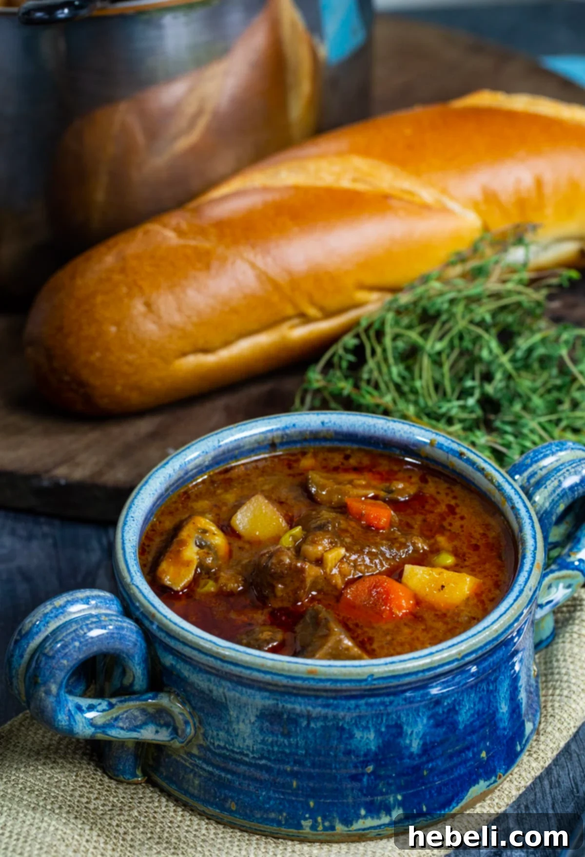 Whiskey-Kissed Beef Stew 5 Another enticing close-up of Bourbon Beef Stew in a ceramic bowl, ready to be enjoyed as a hearty meal.