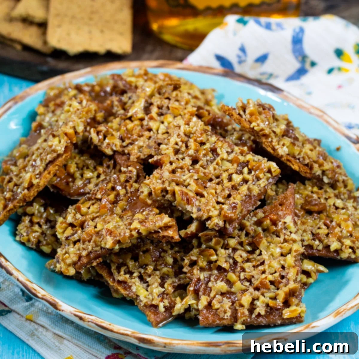 Fireball Graham Cracker Candy on a plate, showcasing its golden, crunchy texture.