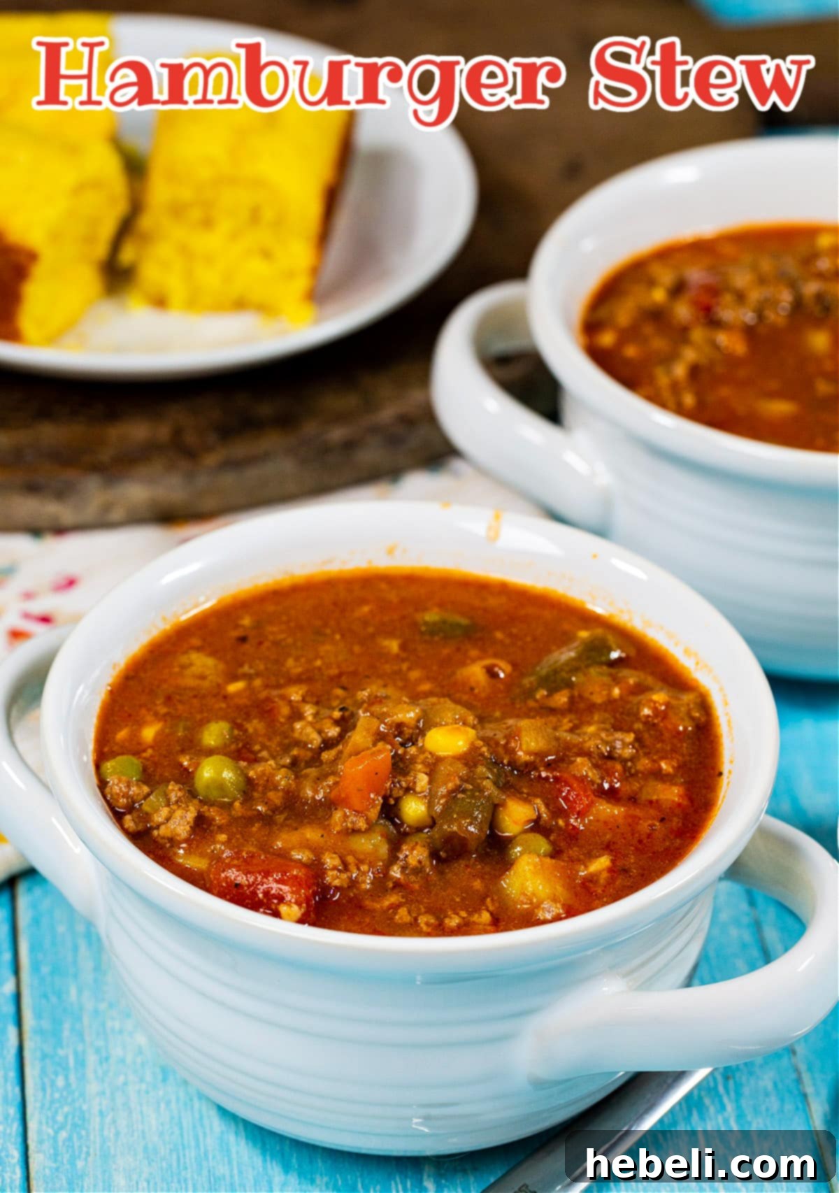 Close-up of Hamburger Stew in soup bowls, highlighting the rich broth and ingredients.