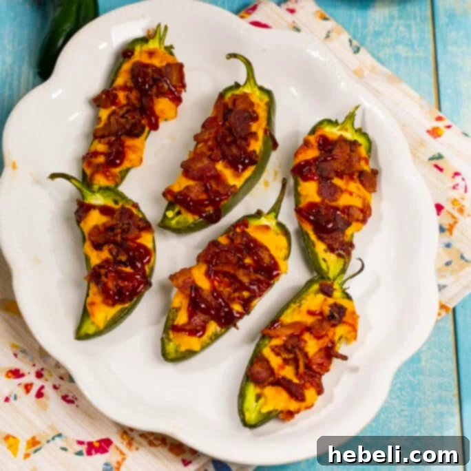 Delicious BBQ Bacon Jalapenos arranged beautifully on a serving plate, ready to be enjoyed.
