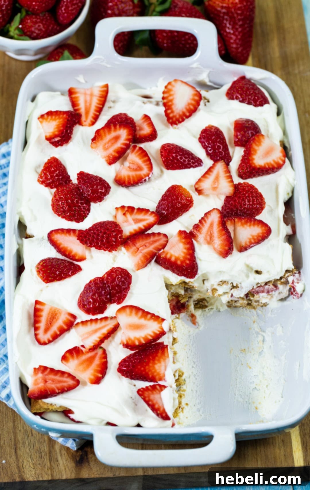 A full Strawberry Icebox Cake presented in a glass baking dish, ready for chilling or serving.