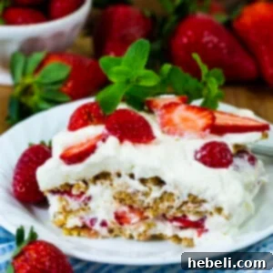 A beautifully composed Strawberry Icebox Dessert, garnished with fresh mint.