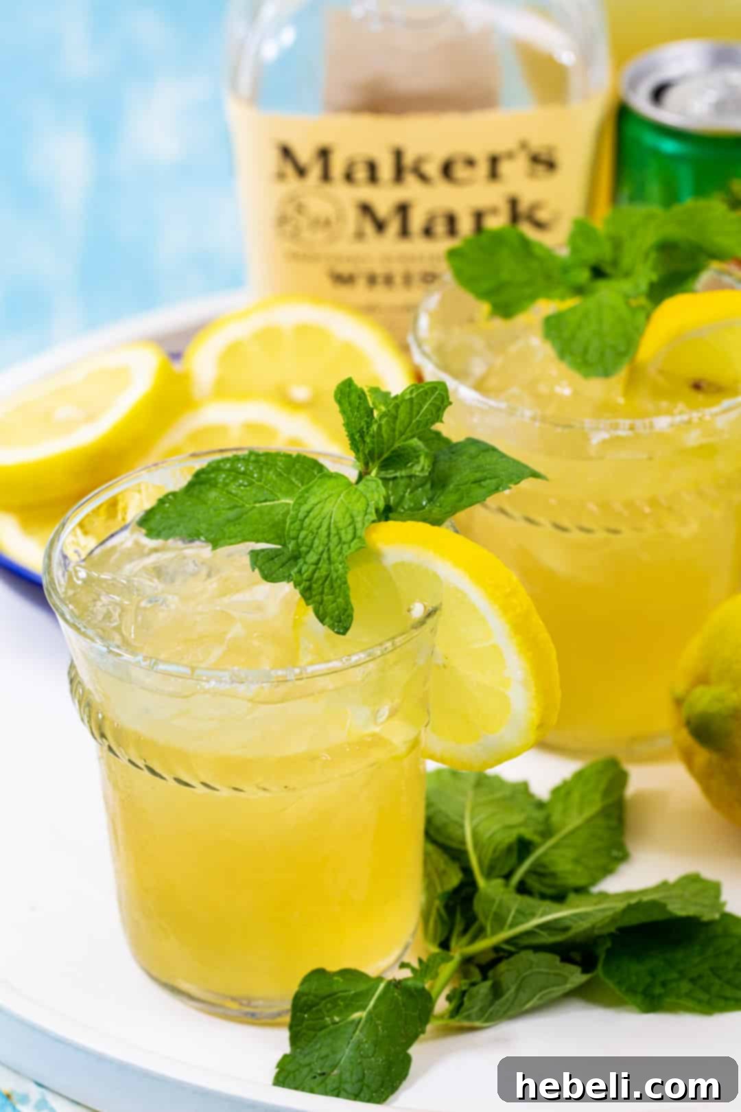 Two Lemonades with bourbon a a tray.