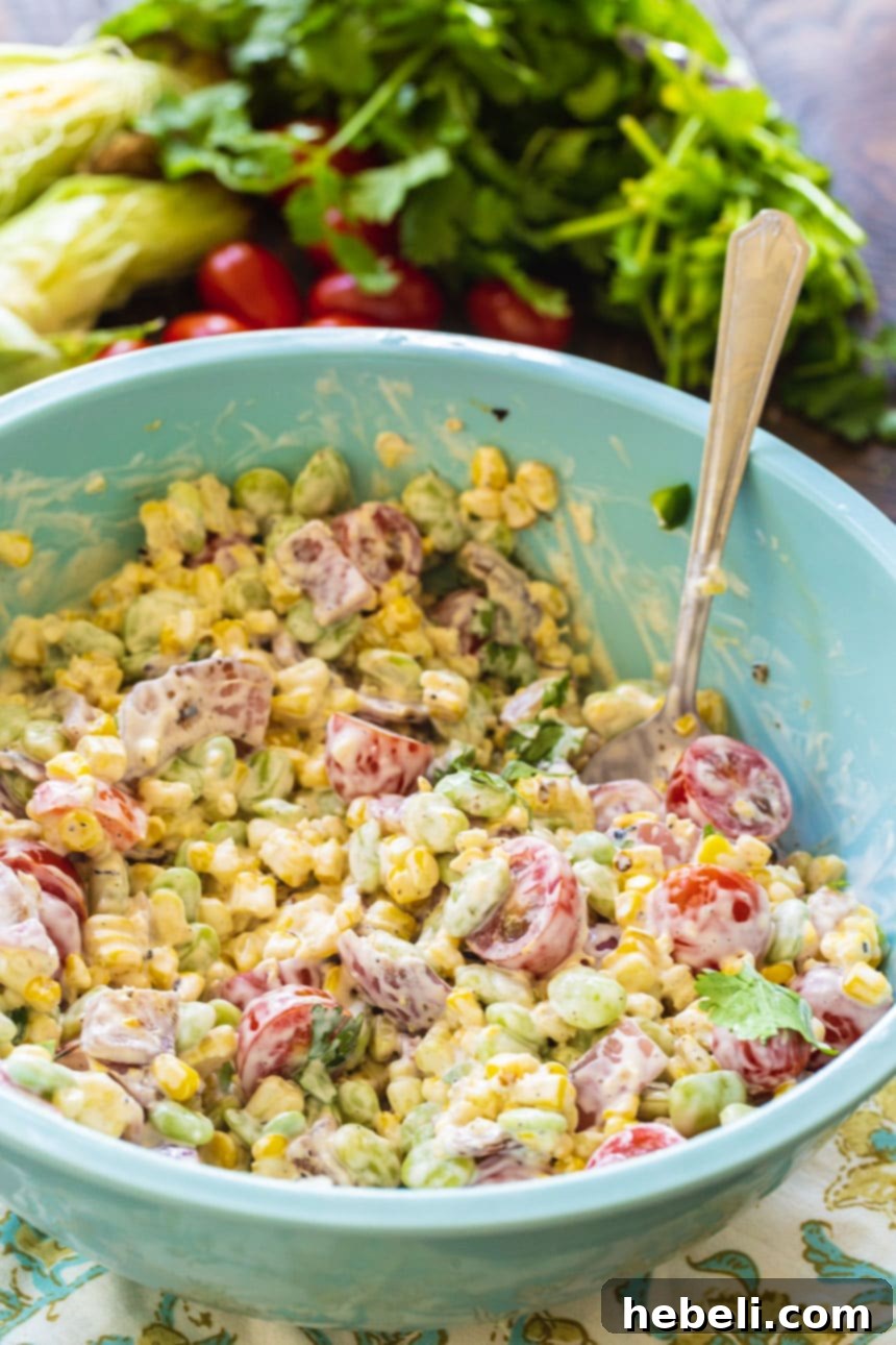 Charred Corn and Butter Bean Summer Medley 3 Grilled Corn and Butter Bean Salad generously portioned in a large, inviting blue serving bowl, ready to be enjoyed.
