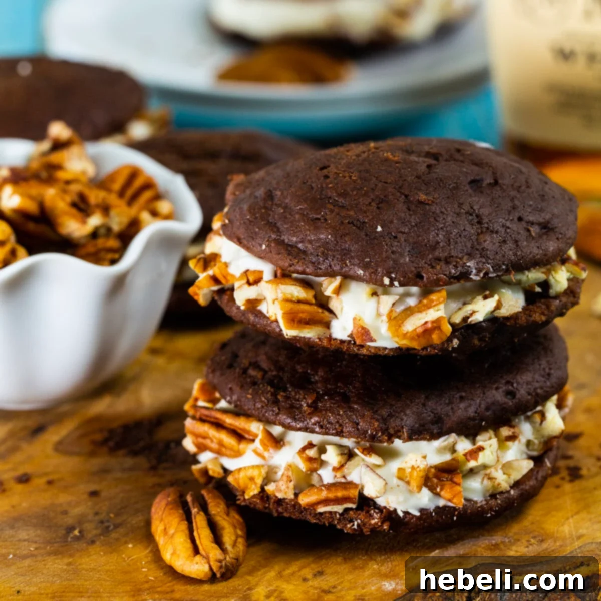 Two Whiskey Whoopie Pies stacked on top of each other, showcasing their inviting texture and generous creamy filling.