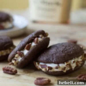 A beautifully presented Whiskey Whoopie Pie, highlighting the perfect golden-brown cookies and creamy filling, ready to be devoured.
