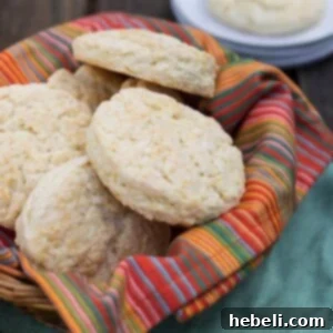 A close-up of a perfectly baked Flying Biscuit Cafe biscuit, golden brown and ready to be served.