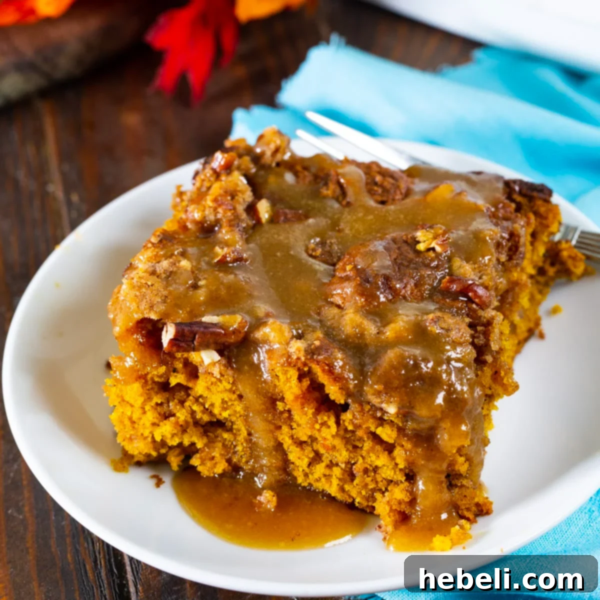 Piece of Pumpkin Coffee Cake with Brown Sugar Glaze on a small plate, ready to be enjoyed.