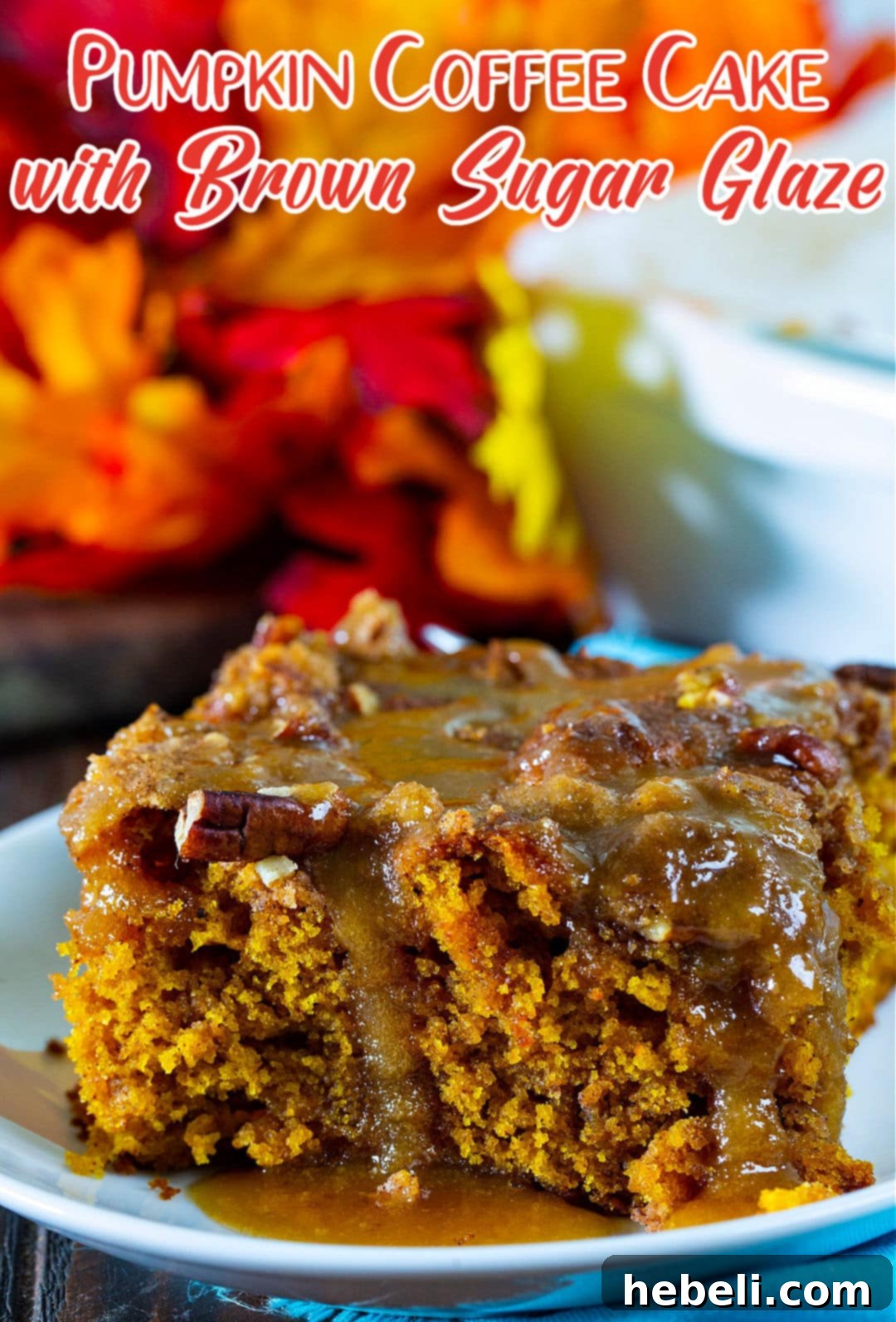A single piece of Pumpkin Coffee Cake with Brown Sugar Glaze artfully presented on a small white plate.