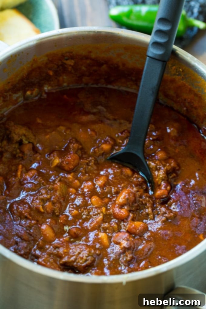 Inferno Chili Recipe 3 Close-up of hearty Five-Alarm Chili, showcasing its rich texture and delicious ingredients.