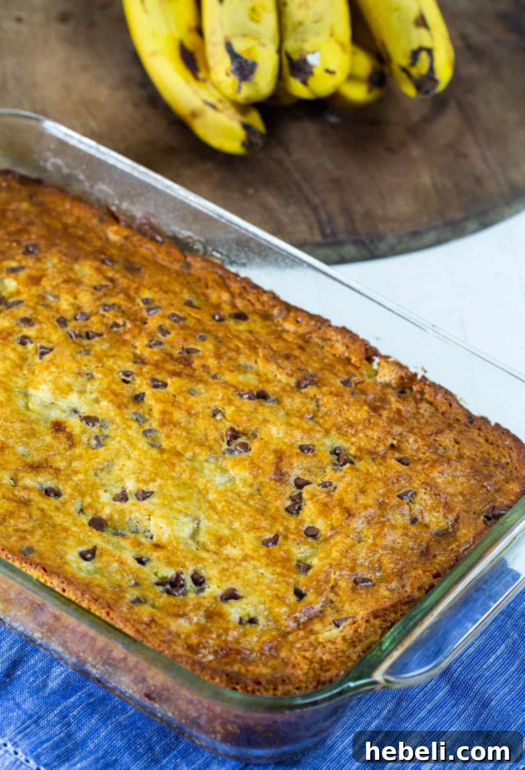 A freshly baked, unfrosted banana cake cooling in a 9x13 inch baking dish, ready for its delicious topping.