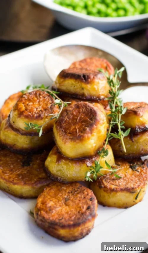 A close-up shot of a single serving of Melting Potatoes, showcasing their perfectly roasted exterior and enticing texture.
