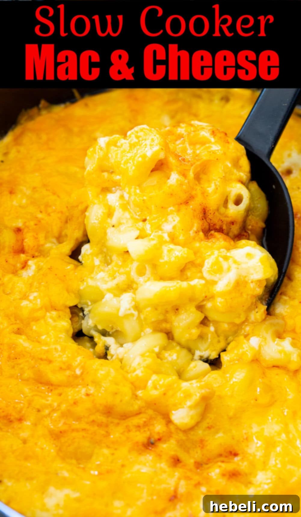 A slow cooker filled with golden, bubbling Mac and Cheese, ready to be served, highlighting its irresistible texture.