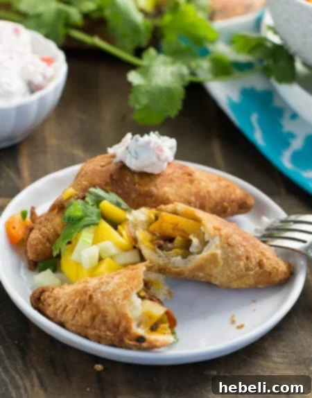 Caribbean Golden Patties 5 A plate of freshly fried West Indies Patties with salsa and sour cream