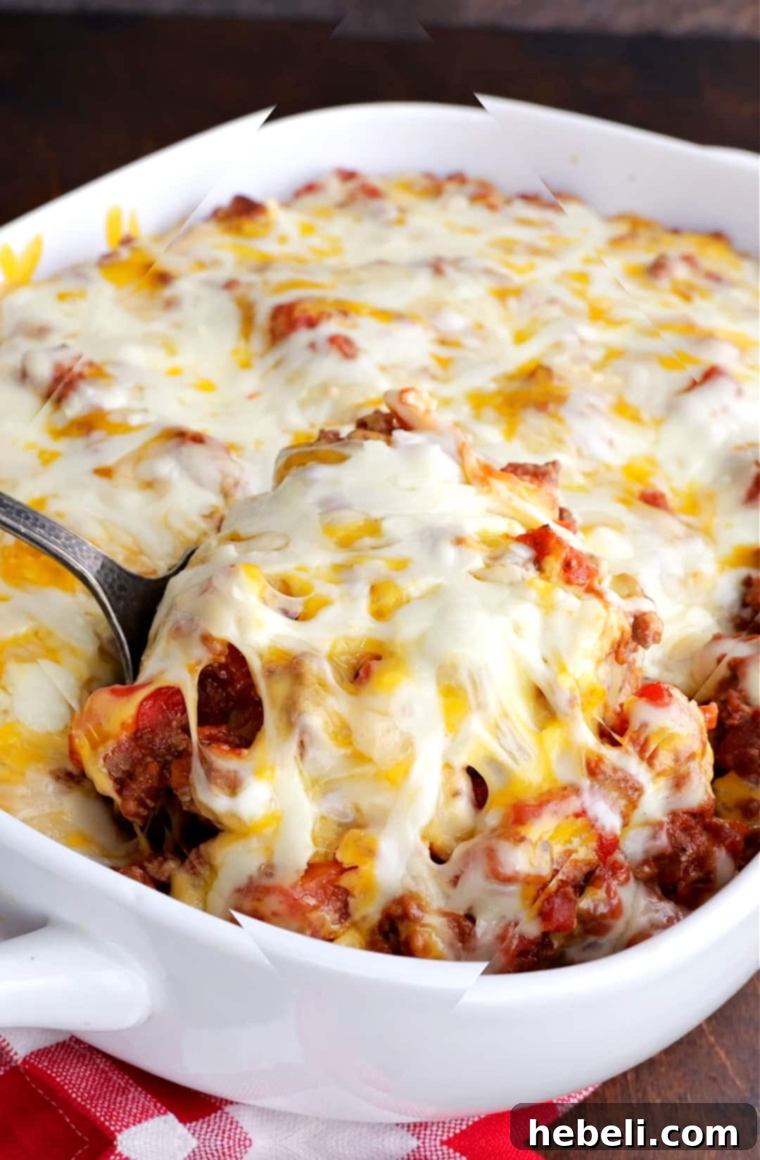 Comforting Ground Beef Supper 8 A large baking dish filled with bubbling, golden-brown Homestyle Ground Beef Casserole, topped with melted cheese, ready to be served.