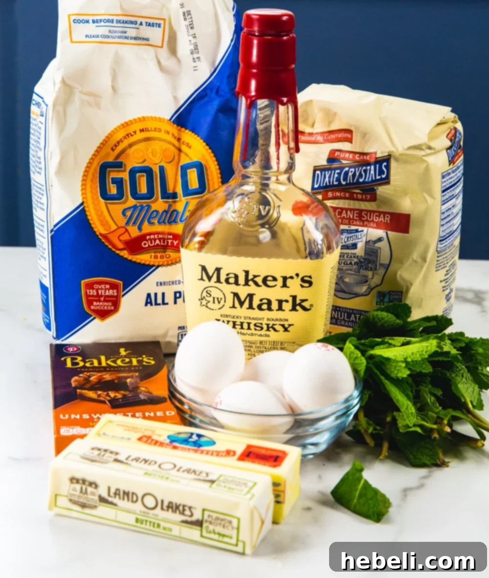 Kentucky Mint Chocolate Brownies 4 Assortment of fresh ingredients neatly laid out on a table, including butter, chocolate, sugar, and mint, showcasing the essentials for baking Mint Julep Brownies.
