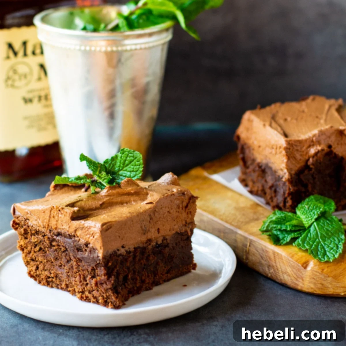 Kentucky Mint Chocolate Brownies 5 A decadent Mint Julep Brownie alongside a classic Mint Julep cocktail in a silver cup, showcasing the dessert's inspiration.
