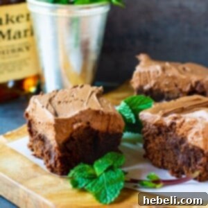 Mint Julep Brownies on a cutting board with fresh mint.