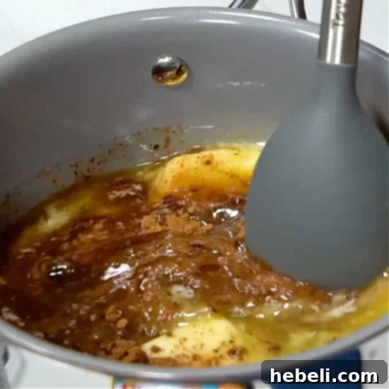 Velvety Chocolate Buttermilk Indulgence 4 Melting butter, cocoa, and water together in a saucepan to create the base for the chocolate buttermilk cake batter.