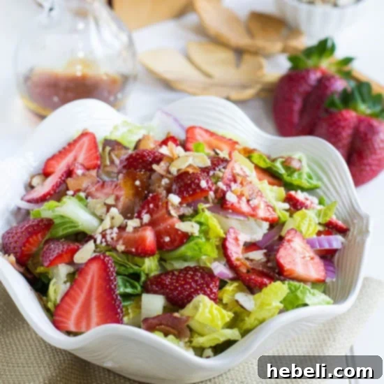 Strawberry Bacon Feta Rhapsody 5 A bowl of Strawberry, Bacon, and Feta Salad with dressing drizzled over it