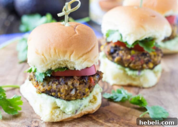 Delicious Baked Pumpkin-Black Bean Sliders with Avocado Sauce, ready for serving on a platter