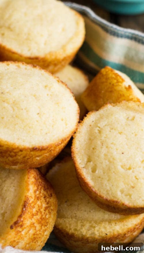 Tangy Golden Cornbread Muffins 3 Close-up of golden Buttermilk Cornbread Muffins, highlighting their fluffy texture.