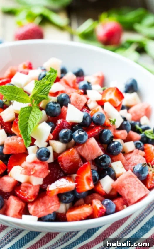 Red, White, and Blue Fruit Salad with a fork