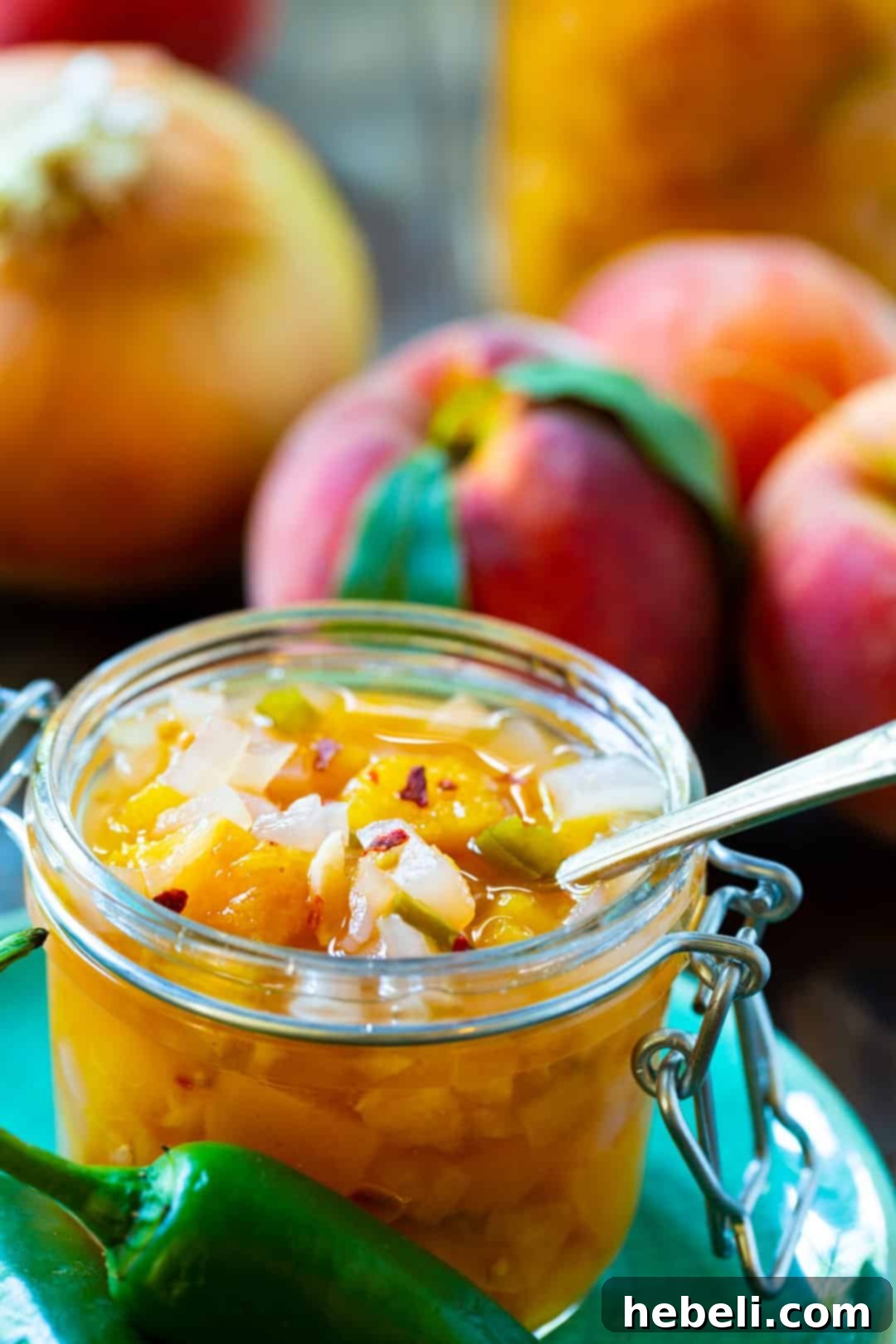 Relish in a glass jar with a spoon stuck in it.